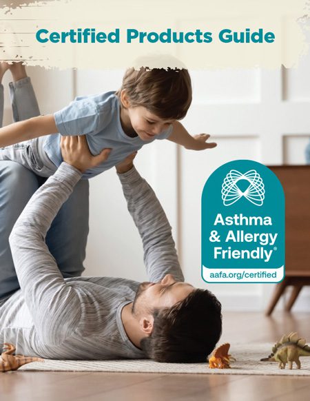The cover of CERTIFIED asthma and allergy friendly products guide that shows a dad laying on the floor holding up his son doing an airplane motion